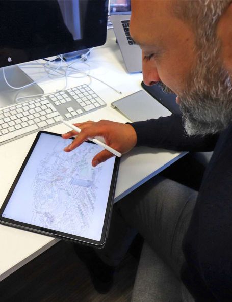 Made Architecture staff member designing on ipad